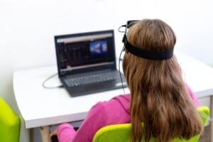 Girl using neurofeedback therapy for ADHD treatment