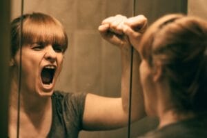 Woman struggling with self-sabotage